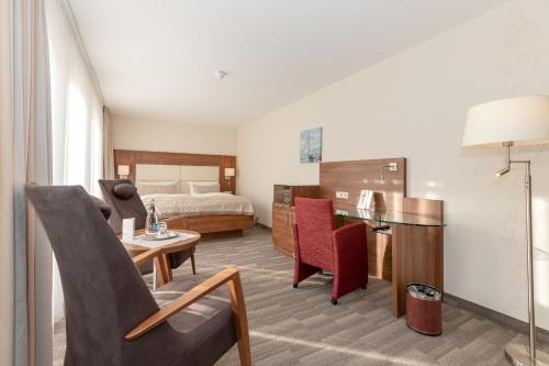 Postel nebo postele na pokoji v ubytování HOTEL am STRAND