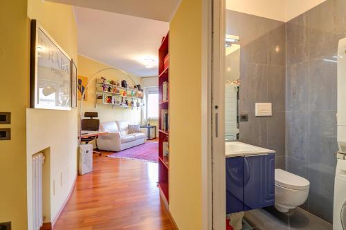a bathroom with a sink and a toilet in a room at Design apartment in the design district of Milan in Milan