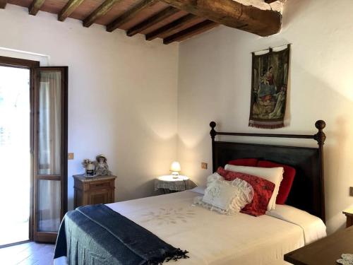 Postel nebo postele na pokoji v ubytování Cuore della Toscana