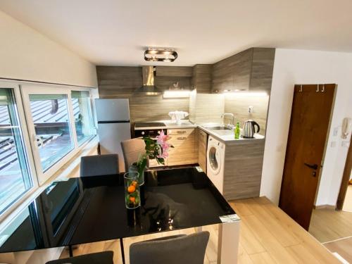a small kitchen with a sink and a stove at Stylish apartment, very good located! in Sofia