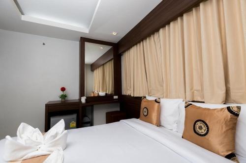 Postel nebo postele na pokoji v ubytování Royal Asia Hotel Pratunam