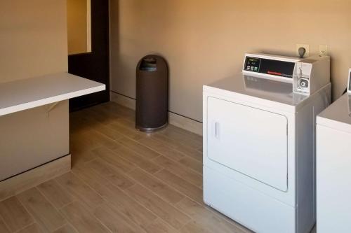 a room with a refrigerator and a trash can at Comfort Inn & Suites Tempe Phoenix Sky Harbor Airport in Tempe