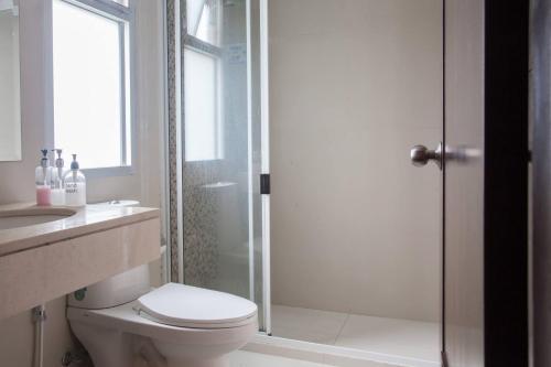 a bathroom with a shower and a toilet and a sink at 6C-Short-term rental allowed-2BRs Downtown Bangkok in Makkasan