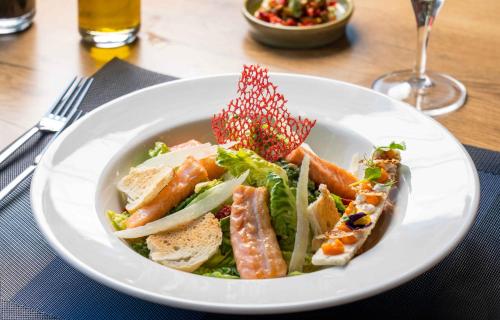 a white plate of food on a table at Ibis Istanbul Tuzla Hotel in Tuzla