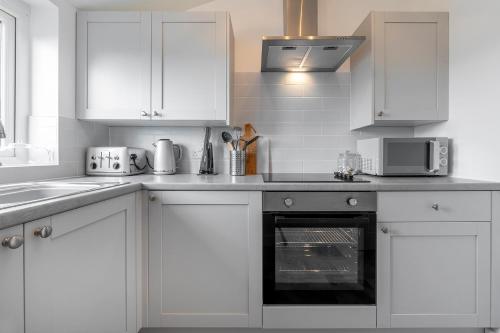 Kuchyň nebo kuchyňský kout v ubytování Sea Breeze Apartment
