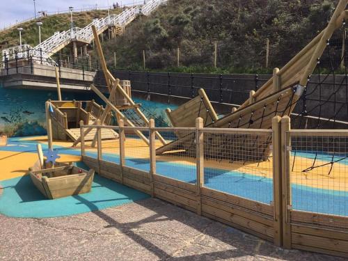 an empty water park with a slide and a boat at Nelson Heights - Perfect seaside retreat, Cromer in Cromer