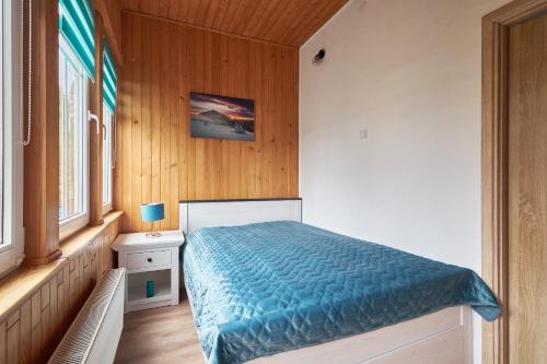 Posteľ alebo postele v izbe v ubytovaní Apartamenty u Bratków
