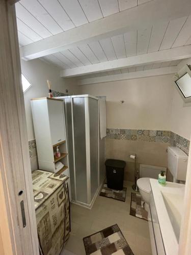 a bathroom with a sink and a toilet at Casa vacanza toledo in Partinico
