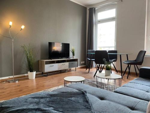 Televisyen dan/atau pusat hiburan di AKK4 - Apartment MD Zentrum nähe Uni und Hbf