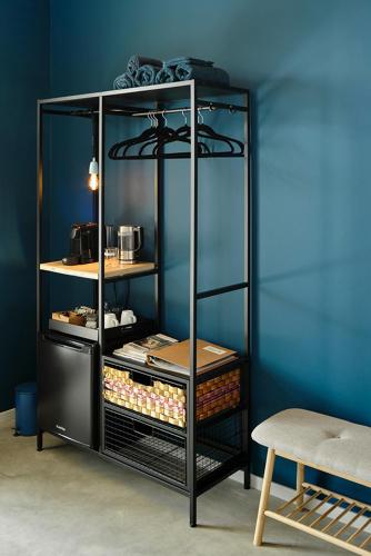 a black shelf with food items in a room at Achterhoeks Goed in Lichtenvoorde-Vragender in Vragender