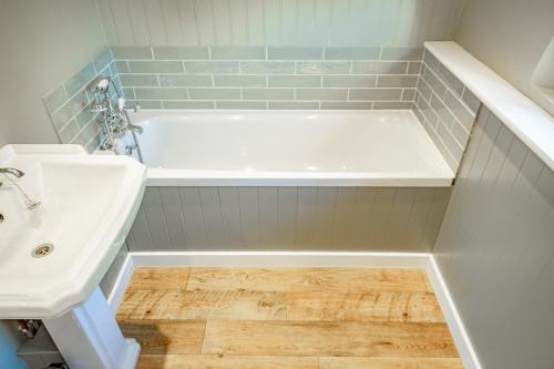 A bathroom at Bragborough Hall Coach House