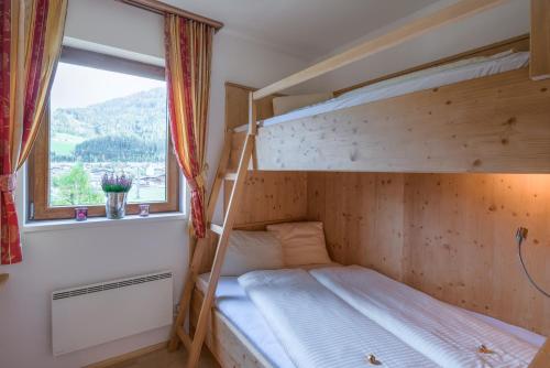 Кровать или кровати в номере Feriendorf Oberhof