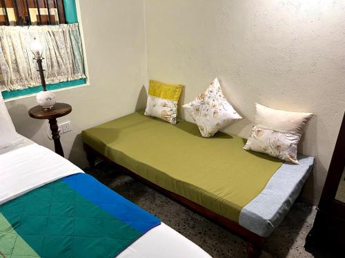 a bedroom with two beds with pillows on them at Ella Nine Peaks in Ella