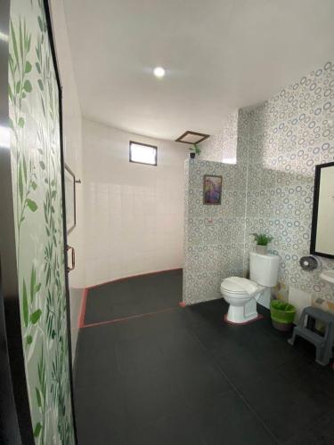 a bathroom with a toilet and a sink at HillSide Boutique in Suratthani