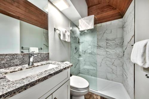 a bathroom with a sink and a toilet at LUXE 15 Blue Diamond Lodge Lake Tahoe Hot Tub in Stateline