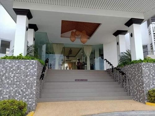 a front door of a house with a staircase at Antara Residential Condominium in Talisay