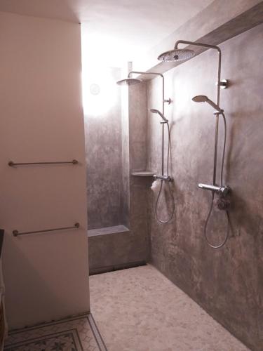 a bathroom with a shower with a glass door at El Violin Experiencia Adults only in Melegis