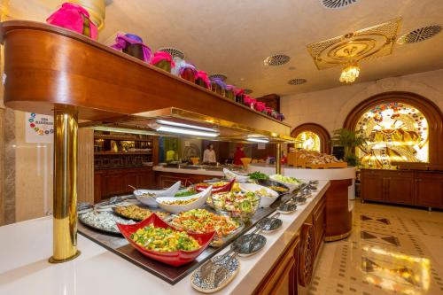 a buffet line with many plates of food on it at Wyndham Istanbul Old City in Istanbul