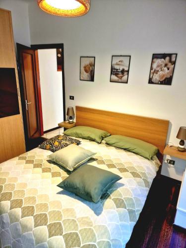 a bedroom with a bed with two pillows on it at CASA BOUNTY in Trieste