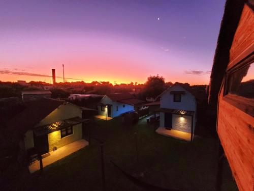 a view of the sunset from the roof of a house at Cabañas Giramundos in Punta Del Diablo