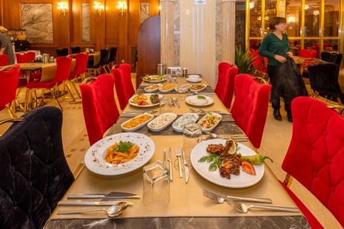 a long table with plates of food on it at Wyndham Istanbul Old City in Istanbul