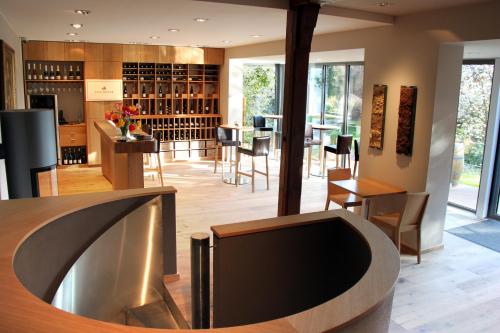 a wine tasting room with a table and chairs at Unterkunft im Weingut Fitz-Ritter in Bad Dürkheim