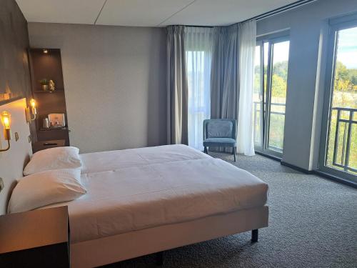Säng eller sängar i ett rum på Parkhotel Horst - Venlo