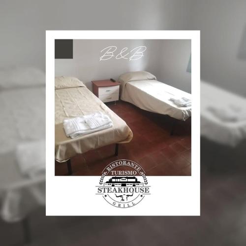 a picture of a bedroom with two beds at Ristorante Turismo Steak house B&B in Modena