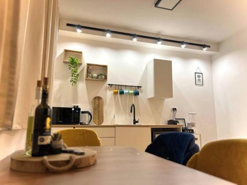 a kitchen with a table and chairs in a room at Deja Vu suite . Feel like Home in Majdal Shams