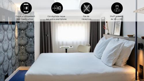 1 dormitorio con cama blanca y ventana en Maison Juste, en Marsella