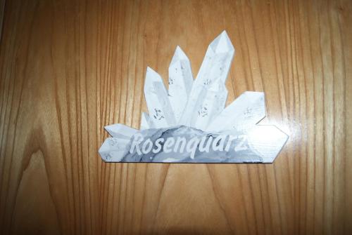 a paper flower on top of a wooden table at Edelsteinhotel Guniwirt in Krakaudorf