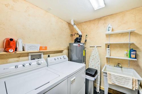 a kitchen with a white stove and a sink at Charming Bedford Cabin with Private Hot Tub! in Thayne