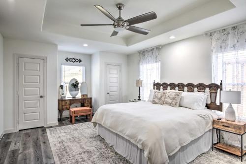 a bedroom with a bed and a ceiling fan at Quiet House with Yard 12 Mi to Dtwn Dallas! in Dallas