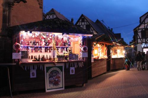 a bar with christmas lights on a street at VVF Plaine d'Alsace Obernai Strasbourg in Obernai