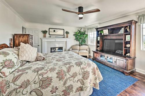 a bedroom with a bed and a flat screen tv at Fallbrook Home with Garden, Gazebo and Fire Pit! in Fallbrook