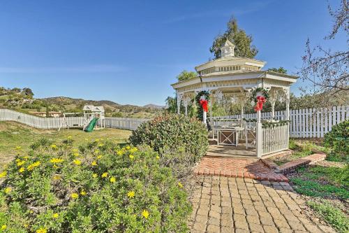 a gazebo in the middle of a garden at Fallbrook Home with Garden, Gazebo and Fire Pit! in Fallbrook