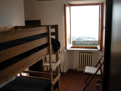 Postel nebo postele na pokoji v ubytování Castello di Mongiovino