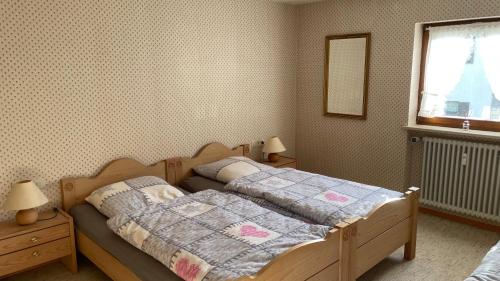 En eller flere senge i et værelse på Ferienwohnung Panoramablick