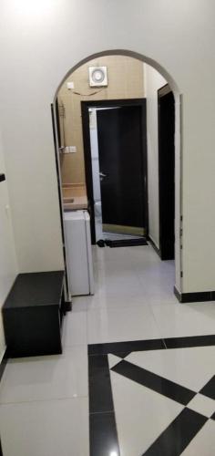 a hallway with an entrance to a building with a door at جولدن نيو خميس مشيط in Khamis Mushayt