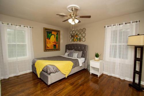a bedroom with a bed and a ceiling fan at Midtown Serenity in Little Rock in Little Rock