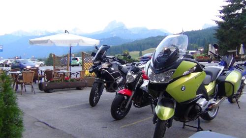 a row of motorcycles parked in a parking lot at Hotel Al Larin in Cortina dʼAmpezzo