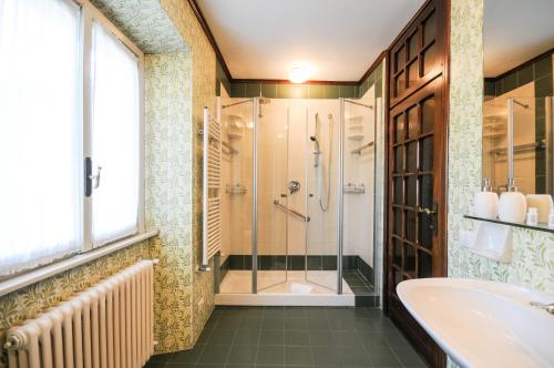 a bathroom with a shower and a sink at CASA VASCONI CERNOBBIO in Cernobbio
