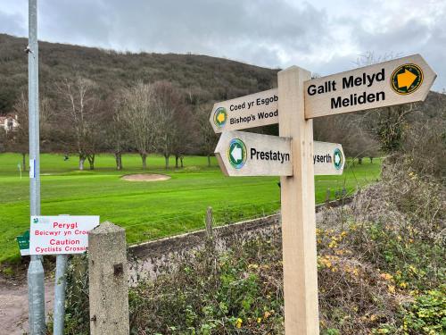 a street sign in a park with signs on it at The Nest in Prestatyn