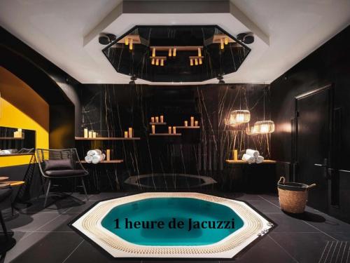 a room with a tub with a sign that reads i home be jazovan at Love Hôtel avec nuit insolite au Dandy et Jacuzzi privatisé in Paris