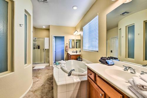 a bathroom with a tub and a sink at Spacious Golf Home with Yard at Indian Palms Resort! in Indio