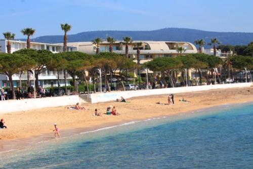 a group of people on a beach near the water at L'AGACHON LA CIOTAT VIEUX PORT in La Ciotat