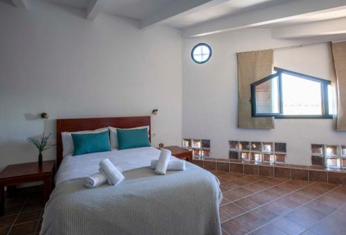 Katil atau katil-katil dalam bilik di Apartamentos Turísticos Lobelia Suites