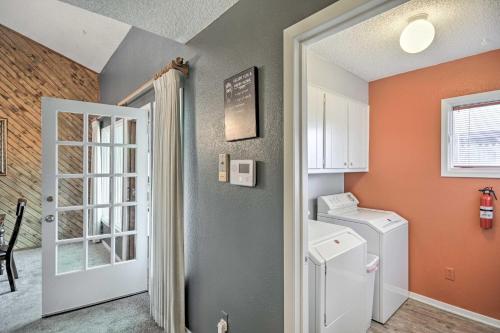 a laundry room with a washer and dryer at Lubbock Townhome with Grill Near TTU and Downtown! in Lubbock