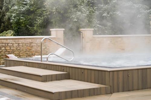 a jacuzzi tub with a hot spring in a building at Barton Hall Hotel & Spa in Kettering