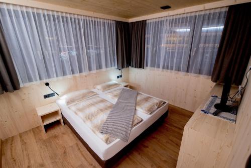Una cama o camas en una habitación de Residence Villa Genziana